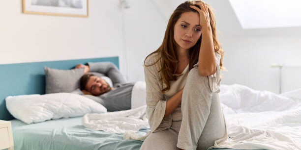 Upset woman thinking about relationship problems and lover indifference